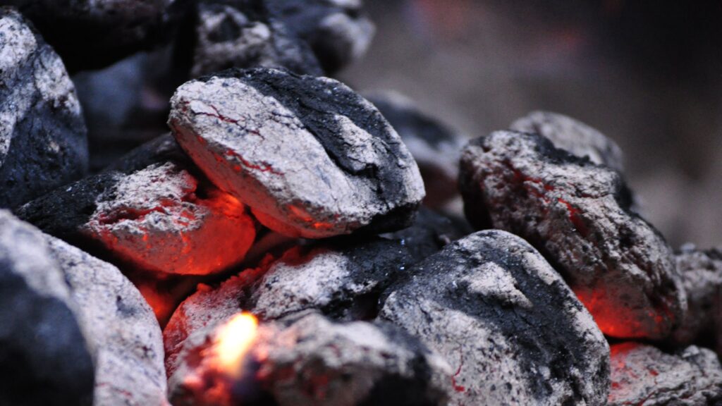 Charcoal briquettes are used in a traditional Japannese yakitori grill
