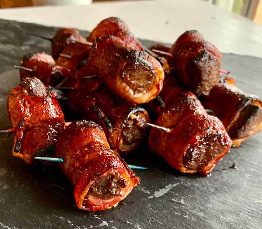  Perfectly cooked elk backstrap, grilled to perfection and wrapped in crispy bacon.